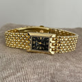 Golden Quartz Rectangular Watch With A Steel Band For Women